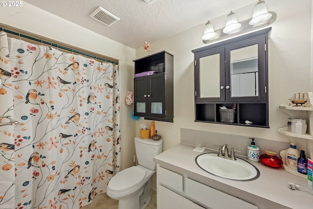 bathroom with a textured ceiling, toilet, visible vents, a shower with shower curtain, and vanity