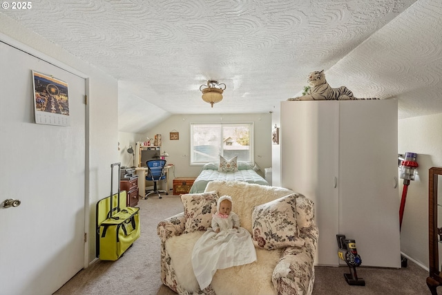 bedroom featuring carpet floors, lofted ceiling, and a textured ceiling