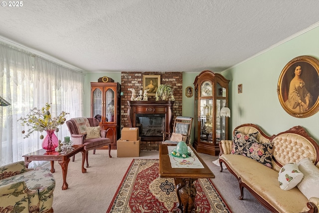 living room featuring carpet, ornamental molding, a textured ceiling, and a fireplace