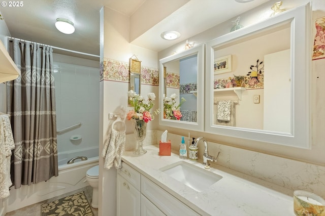 bathroom with shower / tub combo, vanity, and toilet