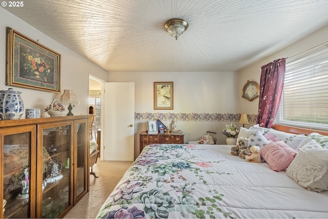 bedroom featuring light colored carpet