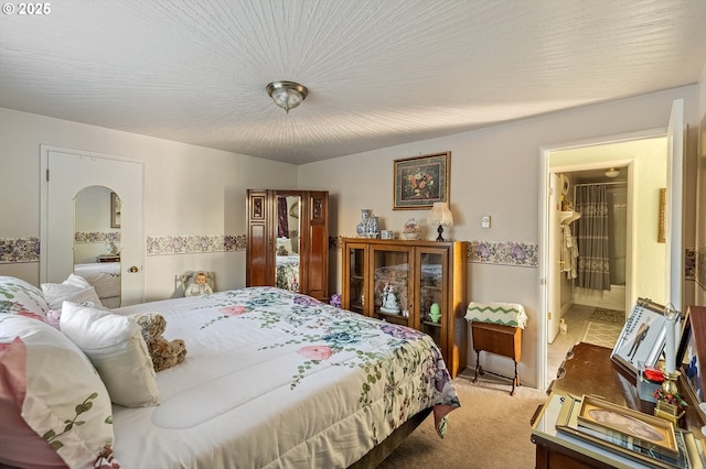 bedroom featuring light colored carpet