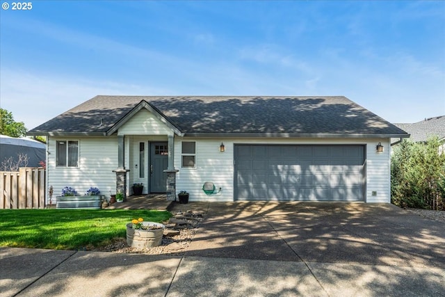 view of front of property featuring concrete driveway, fence, a shingled roof, and a garage
