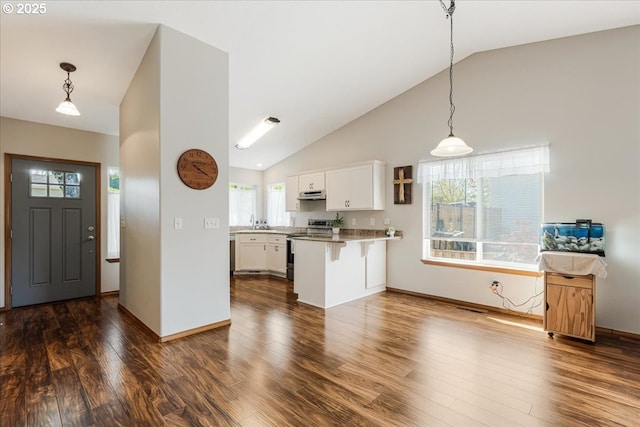 kitchen with white cabinetry, a peninsula, vaulted ceiling, and stainless steel range with electric cooktop