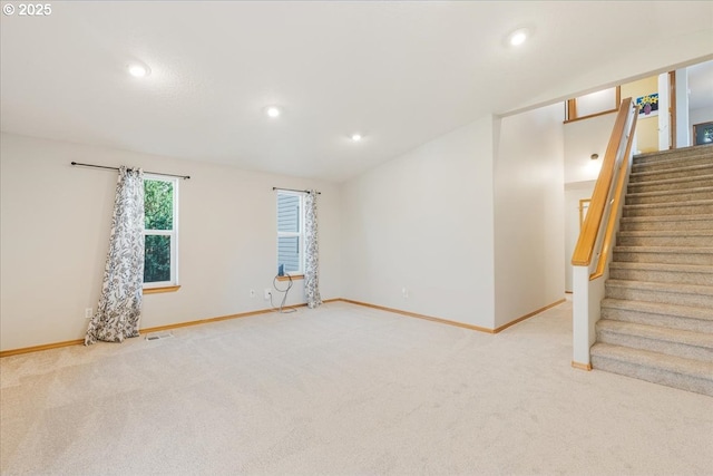 unfurnished room with stairway, baseboards, carpet flooring, and recessed lighting