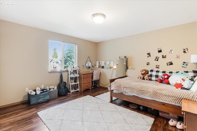 bedroom featuring wood finished floors