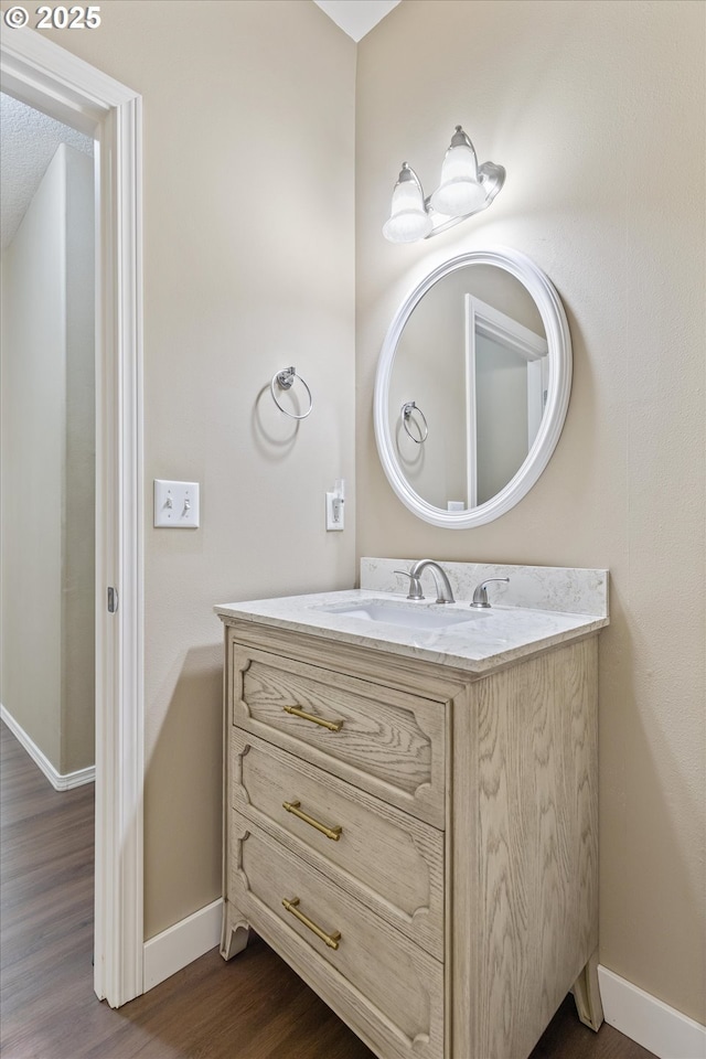 18407 NE 20th St, Vancouver, WA 98684 - bathroom featuring baseboards, wood finished floors, and vanity