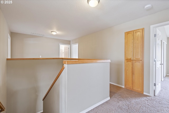 18407 NE 20th St, Vancouver, WA 98684 - hallway featuring an upstairs landing, light colored carpet, baseboards, and a textured ceiling