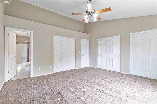 18407 NE 20th St, Vancouver, WA 98684 - unfurnished bedroom with two closets, carpet floors, baseboards, ensuite bathroom, and high vaulted ceiling