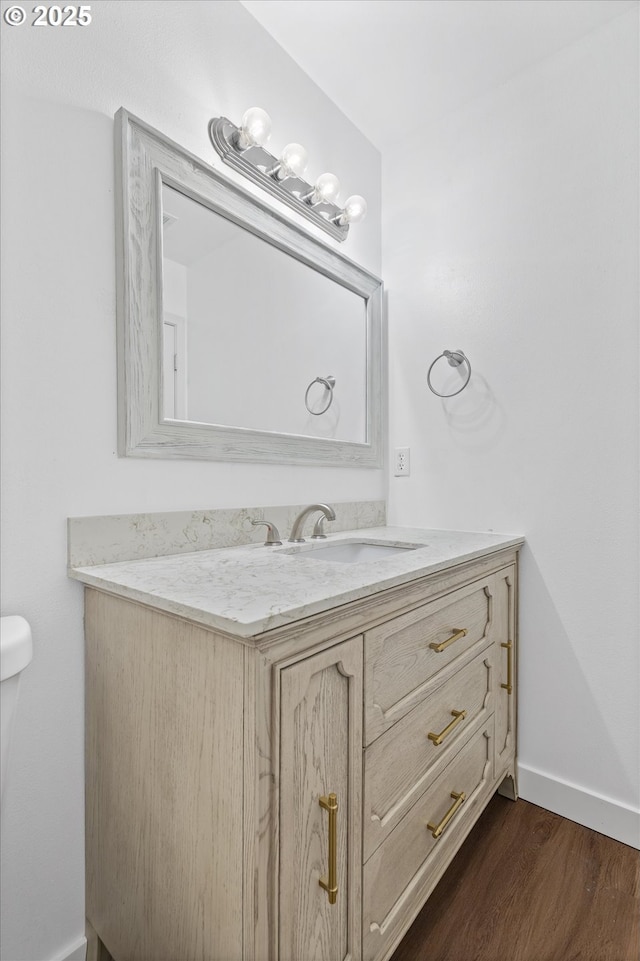 18407 NE 20th St, Vancouver, WA 98684 - bathroom featuring vanity, wood finished floors, baseboards, and toilet
