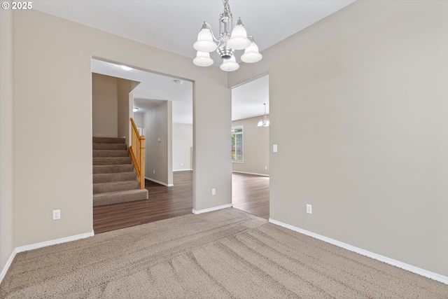 18407 NE 20th St, Vancouver, WA 98684 - unfurnished room with a chandelier, stairway, baseboards, and carpet