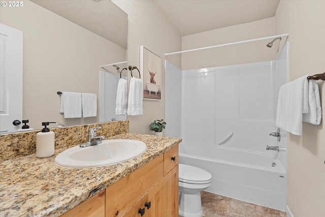 bathroom with toilet, shower / washtub combination, and vanity