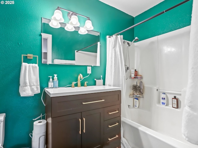 full bathroom with vanity, shower / tub combo, and toilet