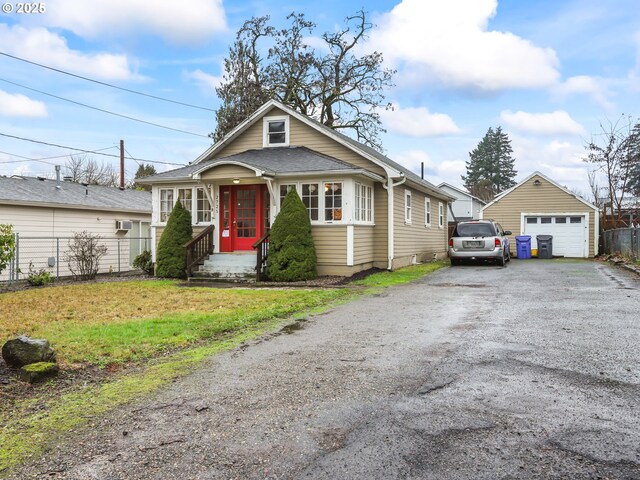 bungalow-style home with a front yard