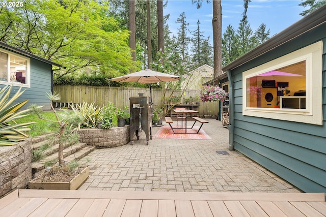 view of patio / terrace featuring fence and outdoor dining area