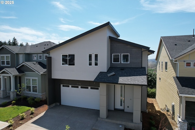 15192 SW Huntwood St, Tigard, OR 97224 - contemporary home with a garage, driveway, and a shingled roof