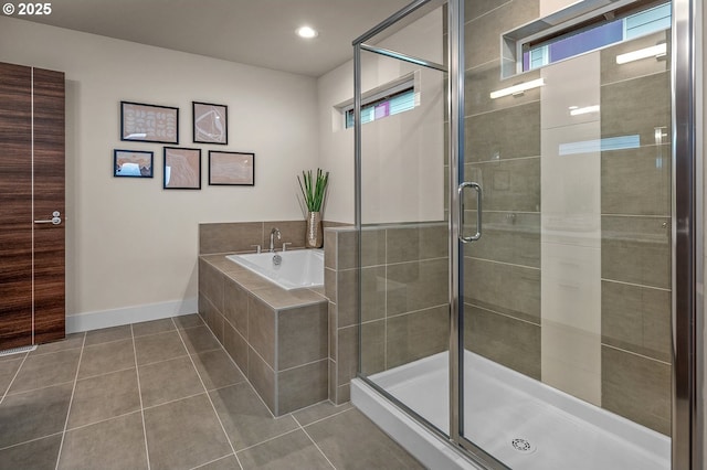 15192 SW Huntwood St, Tigard, OR 97224 - bathroom featuring tile patterned flooring, a garden tub, a stall shower, and recessed lighting