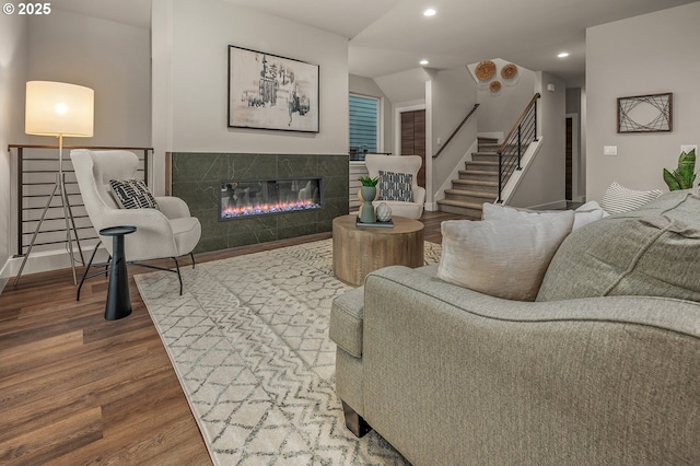 15192 SW Huntwood St, Tigard, OR 97224 - living area featuring wood finished floors, stairs, a tile fireplace, recessed lighting, and lofted ceiling