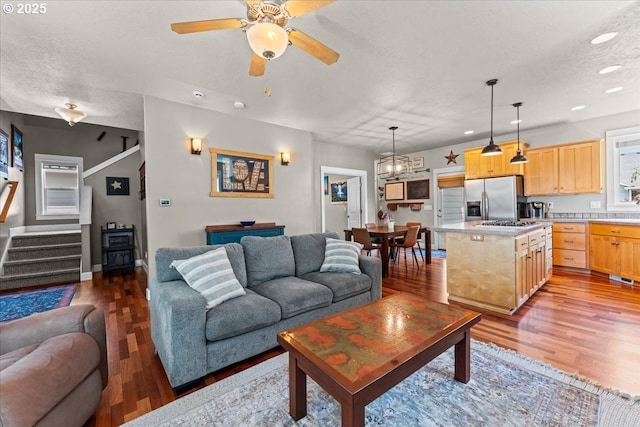 1609 Wood Duck St, Silverton, OR 97381 - living area with stairway, recessed lighting, wood finished floors, and a ceiling fan