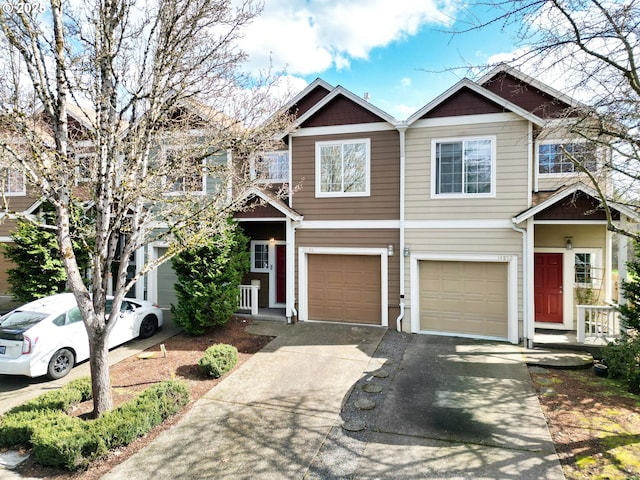 view of property featuring a garage and driveway