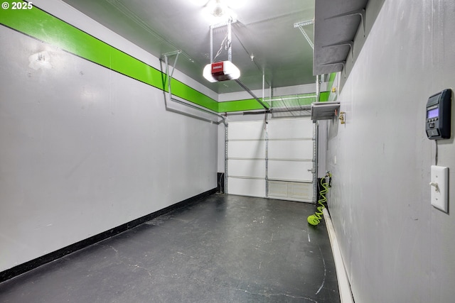 garage featuring baseboards and a garage door opener