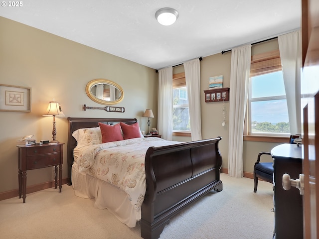 88724 Schroeder Rd, Gearhart, OR 97138 - bedroom featuring light colored carpet, baseboards, and multiple windows