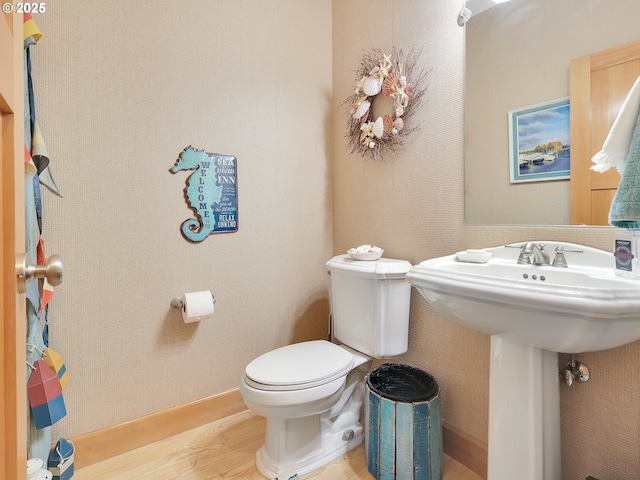 88724 Schroeder Rd, Gearhart, OR 97138 - bathroom featuring wood finished floors and toilet