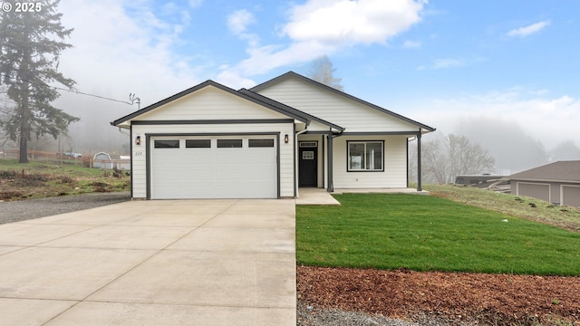 view of front of home featuring a garage, a front yard, and a porch