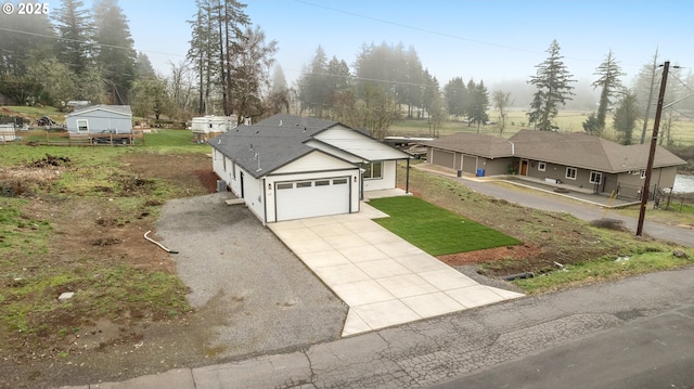 view of front facade with a garage and a front yard