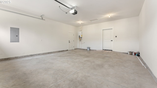 garage featuring a garage door opener, electric panel, and water heater