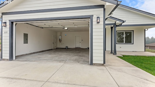 garage with a garage door opener and electric panel