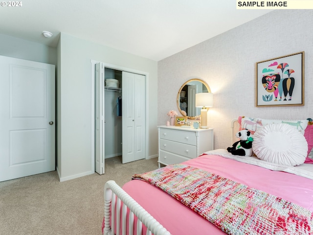 bedroom featuring light carpet and a closet