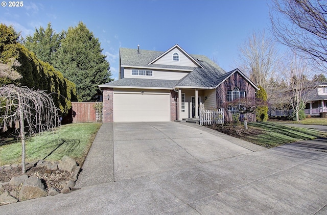 view of front of house with a garage and a front lawn