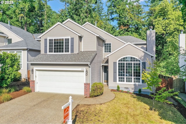 14846 NW Fawnlily Dr, Portland, OR 97229 - traditional home featuring driveway, an attached garage, a chimney, and a shingled roof