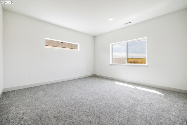 534 Grant St, Umatilla, OR 97882 - empty room with healthy amount of natural light, carpet flooring, and baseboards
