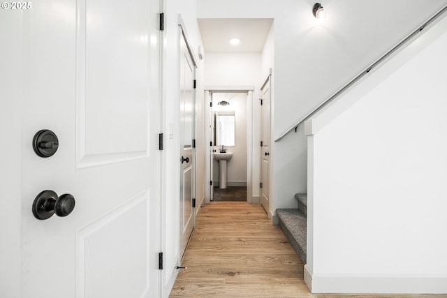 534 Grant St, Umatilla, OR 97882 - corridor with light wood finished floors and stairway