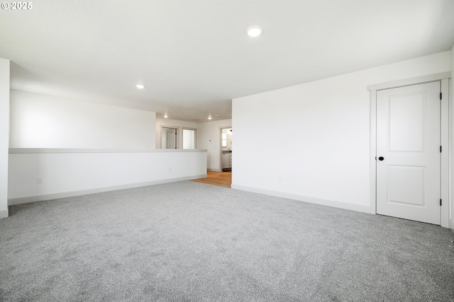 534 Grant St, Umatilla, OR 97882 - unfurnished living room with light colored carpet, recessed lighting, and baseboards