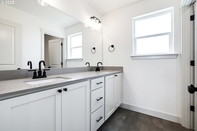 534 Grant St, Umatilla, OR 97882 - bathroom featuring double vanity and baseboards