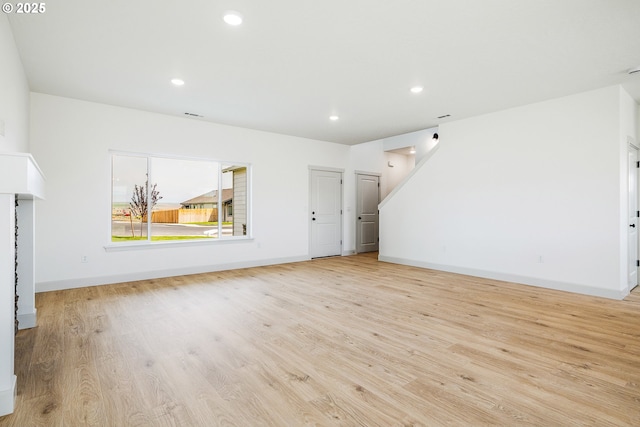 534 Grant St, Umatilla, OR 97882 - unfurnished living room featuring light wood-style flooring, baseboards, and recessed lighting