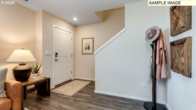 entryway with baseboards, visible vents, recessed lighting, and dark wood finished floors