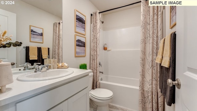 bathroom featuring toilet, vanity, and shower / bath combo with shower curtain