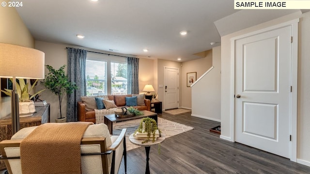 living area with baseboards, recessed lighting, and dark wood-style flooring