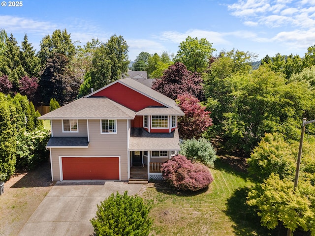 1601 NW 2nd Ave, Battle Ground, WA 98604 - traditional home with a garage, driveway, covered porch, and roof with shingles