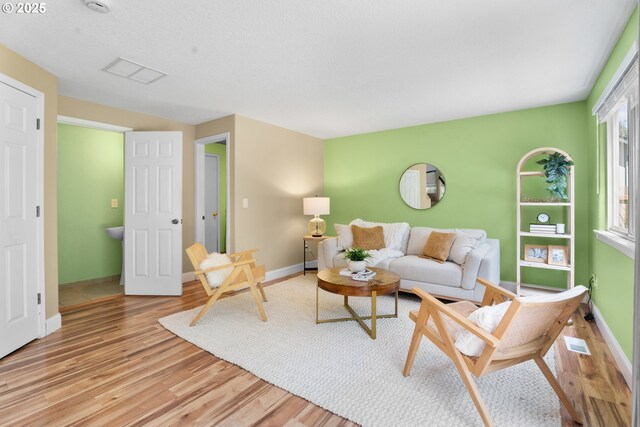 1601 NW 2nd Ave, Battle Ground, WA 98604 - living room featuring light wood finished floors and baseboards