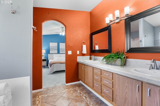 1601 NW 2nd Ave, Battle Ground, WA 98604 - bathroom with double vanity, ensuite bath, tile patterned floors, a ceiling fan, and a textured wall