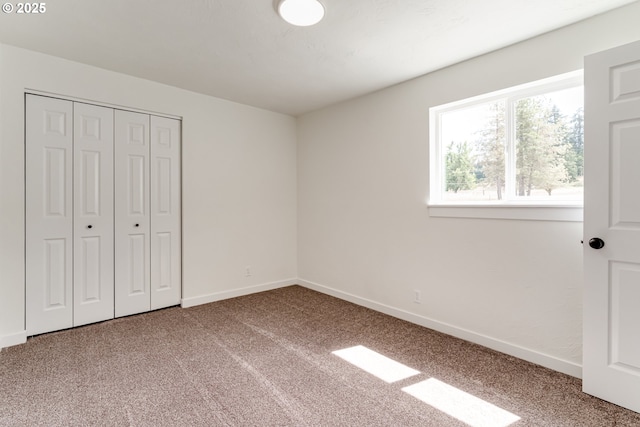 85160 Larson Rd, Eugene, OR 97405 - unfurnished bedroom with carpet, baseboards, and a closet