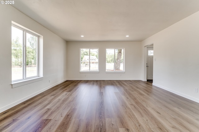 85160 Larson Rd, Eugene, OR 97405 - empty room featuring plenty of natural light, wood finished floors, baseboards, and recessed lighting