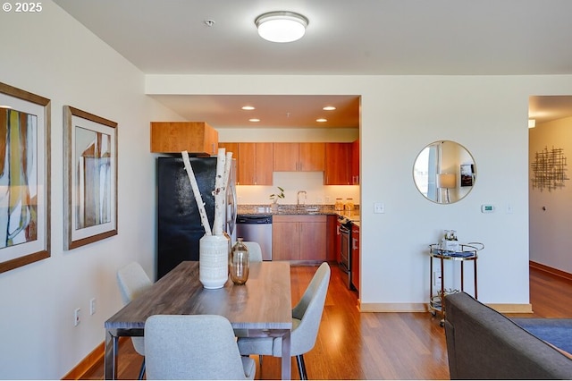 dining room with wood-type flooring