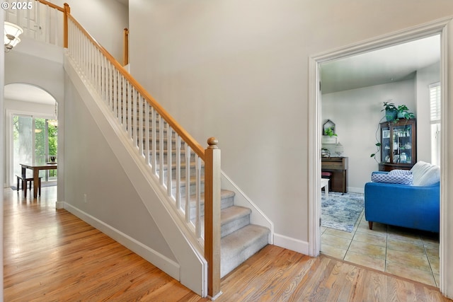 8503 SE 139th Ct, Portland, OR 97236 - stairway featuring arched walkways and wood finished floors