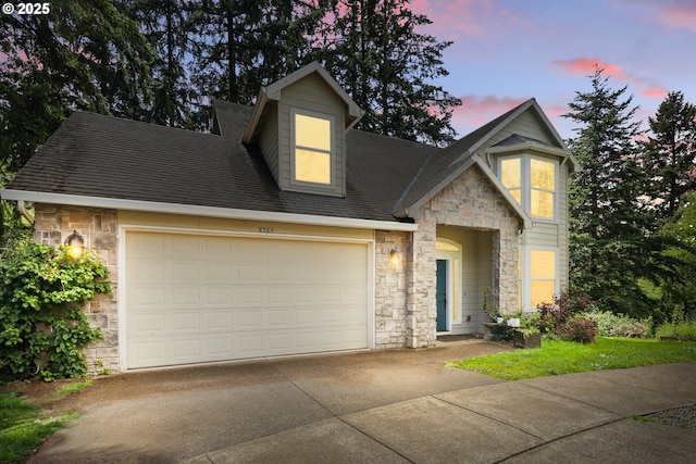 8503 SE 139th Ct, Portland, OR 97236 - view of front facade with stone siding, a garage, concrete driveway, and a shingled roof